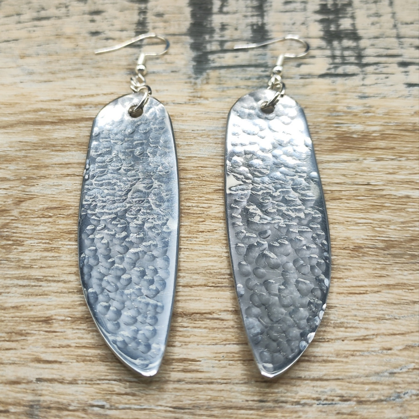 Hammered stainless steel fish knife drop earrings