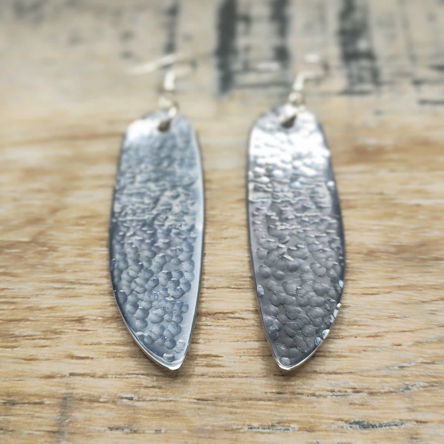 Hammered stainless steel fish knife drop earrings