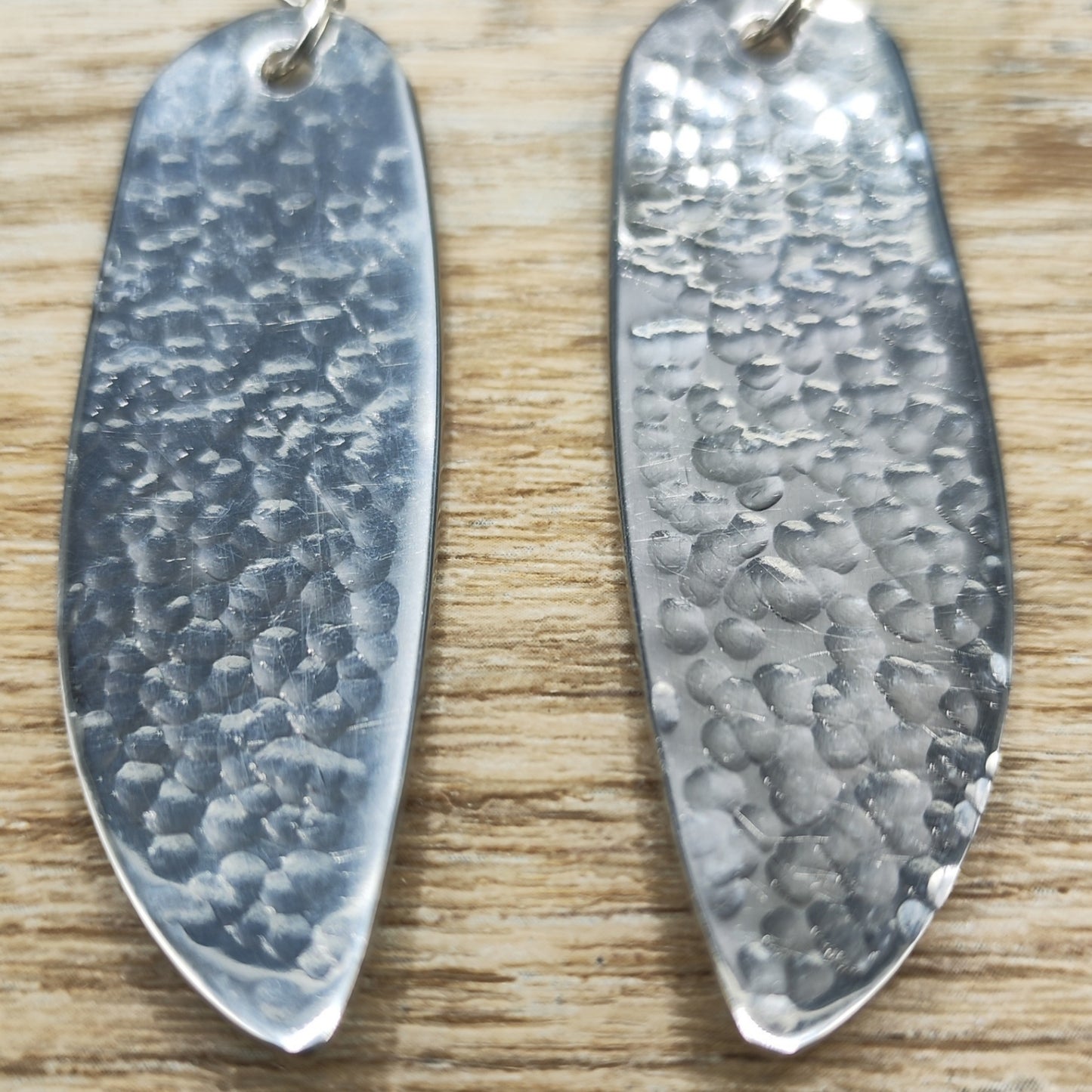 Hammered stainless steel fish knife drop earrings